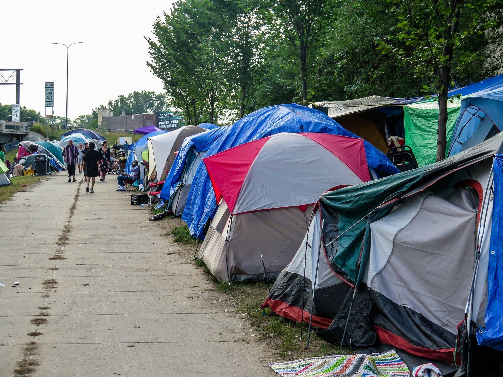  Dozens of tents are crammed into a patch of grass near East Franklin and Hiawatha avenues in south Minneapolis on Wednesday. Mark Zdechlik | MPR News 