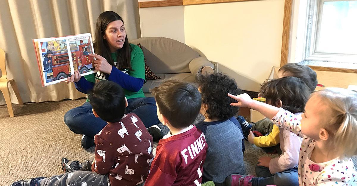 Heather reads to kids in the U of M CDC classroom.