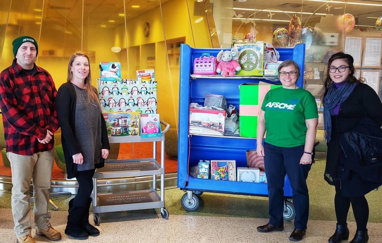 AFSCME Members with toy colleciton for donations.
