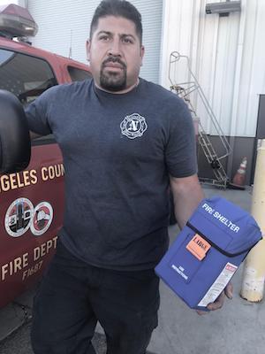 Pictured: Frankie Martinez AFSCME member Frankie Martinez standing in front of a LA Co. Fire Department vehicle