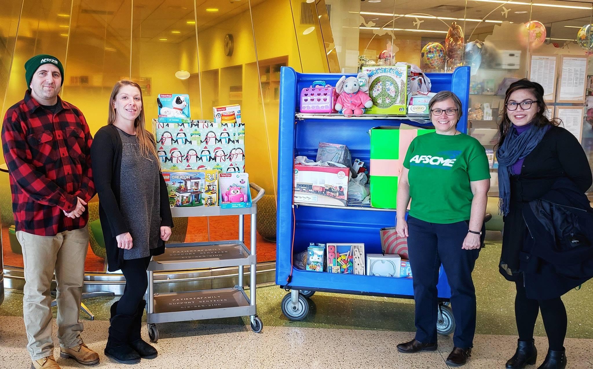 Local 3800 members show off the toys collected for the UMN Masonic Children's Hospital